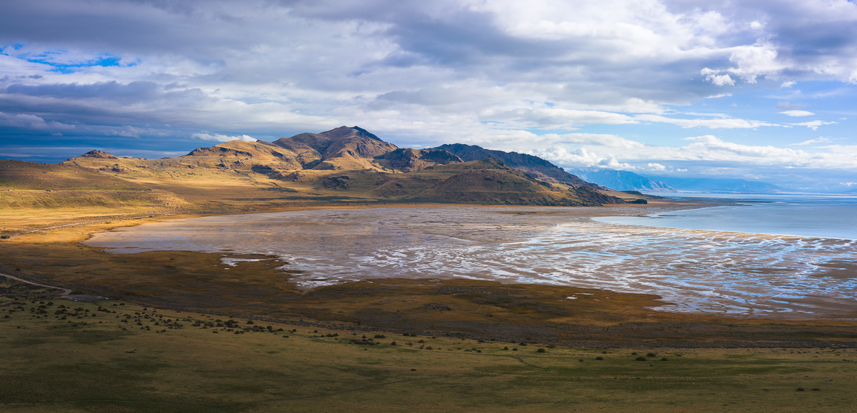 Salt flats and barren hills meet the receding waters of an ancient lake.